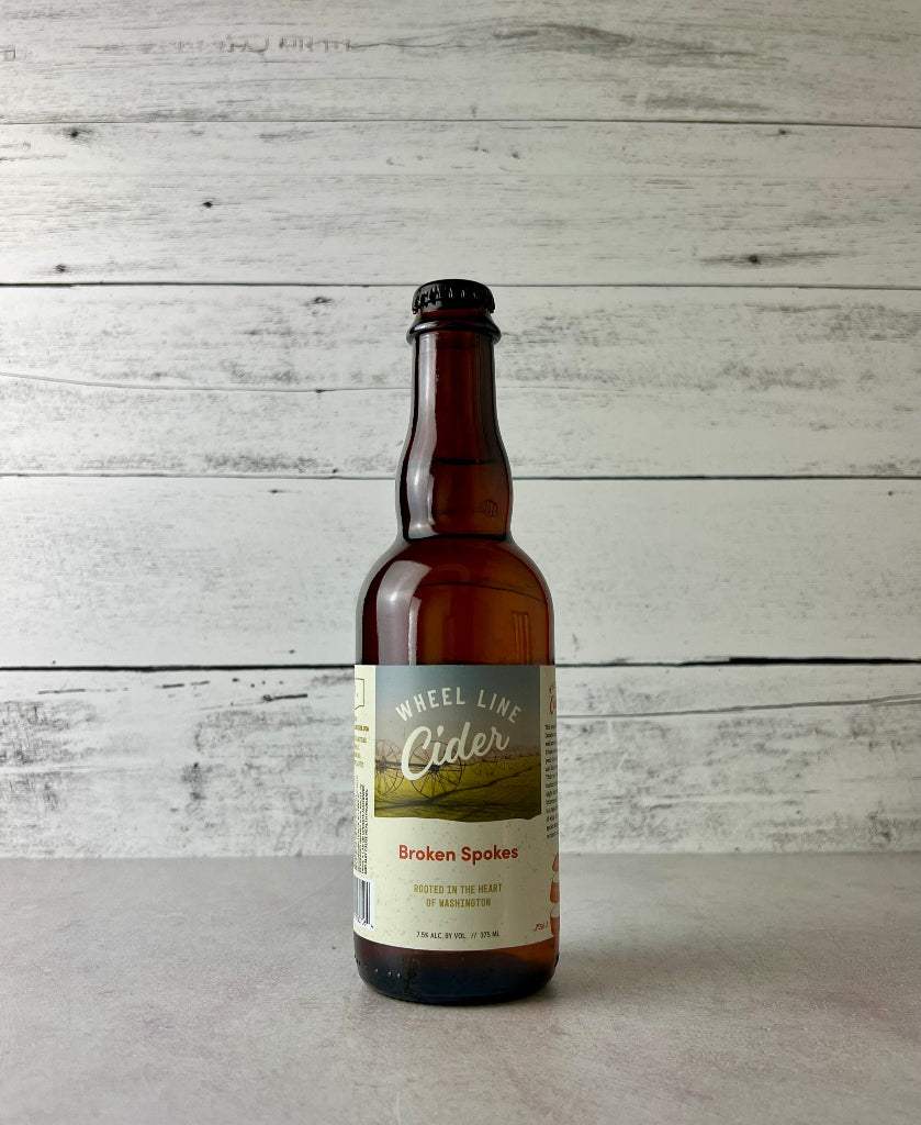 375 mL bottle of Wheel Line Cider Broken Spokes - Rooted in the heart of Washington
