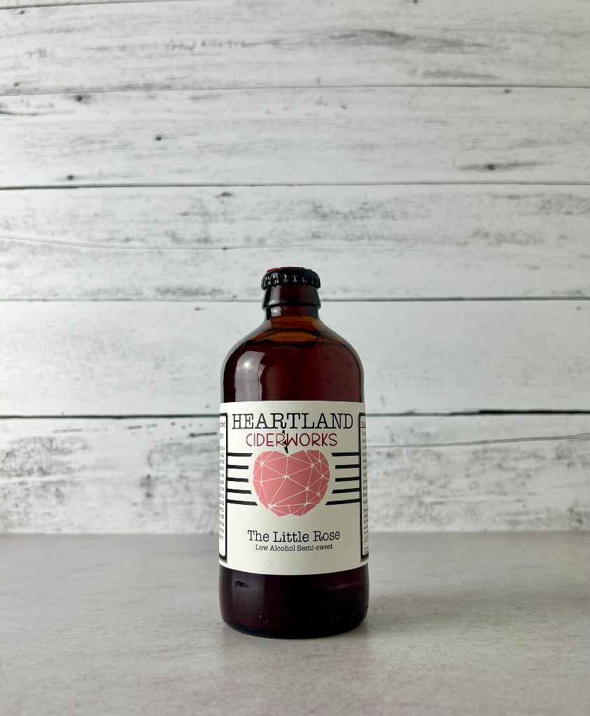 Photo of a 12 oz bottle of Heartland Ciderworks The Little Rose Low Alcohol Semi-Sweet cider