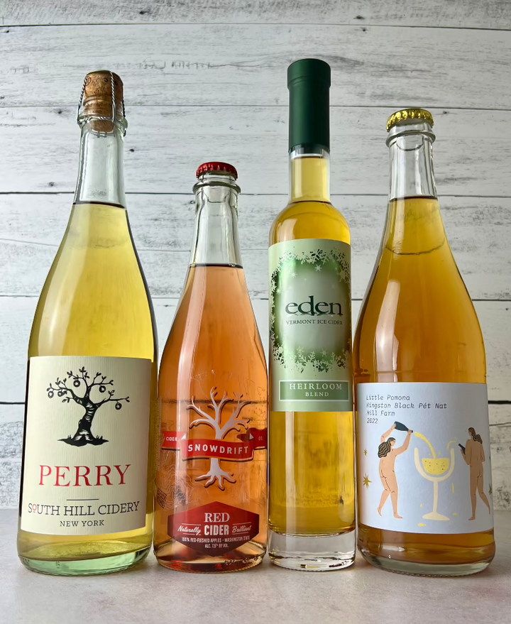 4 bottles of cider: South Hill Cidery Perry, Snowdrift Red Cider, Eden Ice Cider, and Little Pomona Kingston Black Pet Nat