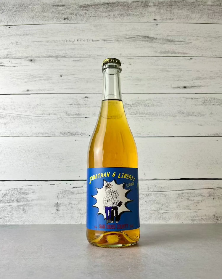 750 mL bottle of Raging Jonathan & Liberty cider