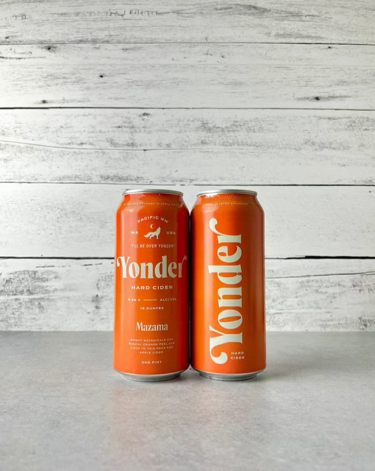 Two orange 16-oz cans of Yonder Hard Cider Mazama