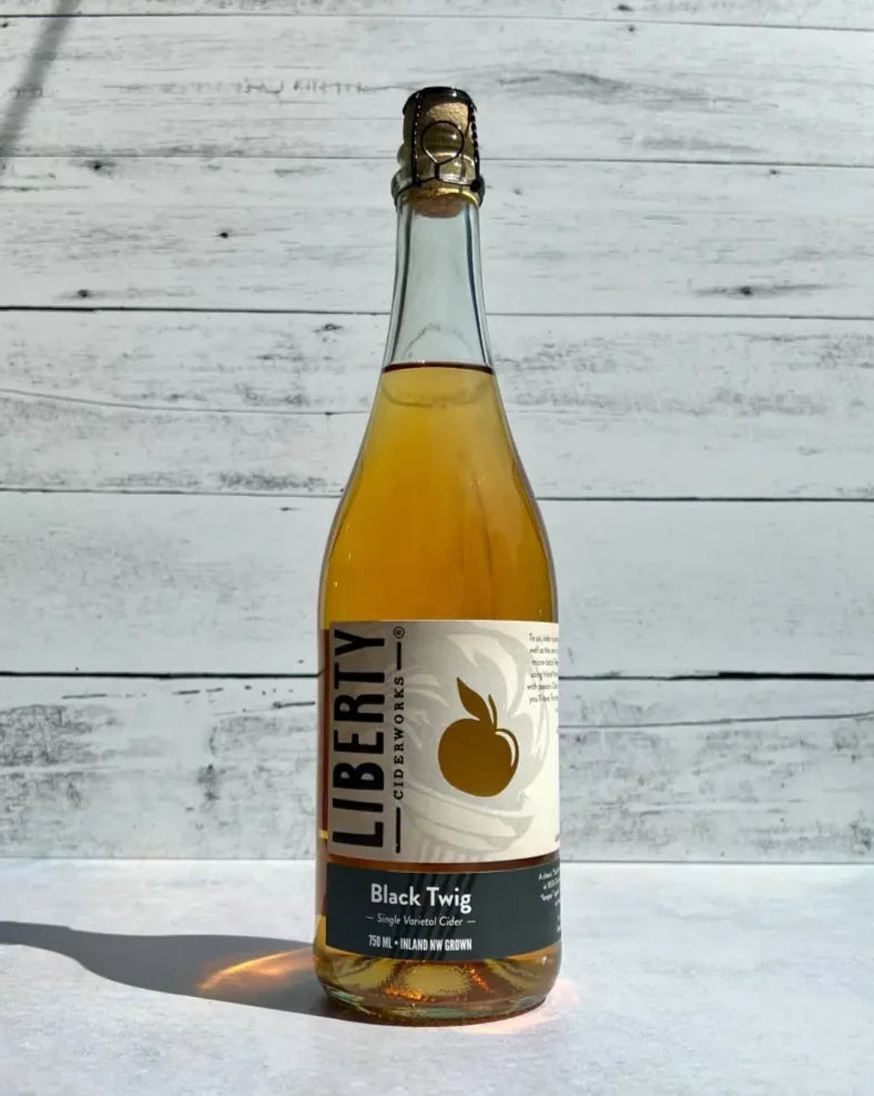 750 mL clear glass bottle of Liberty Ciderworks Black Twig Single Varietal Cider