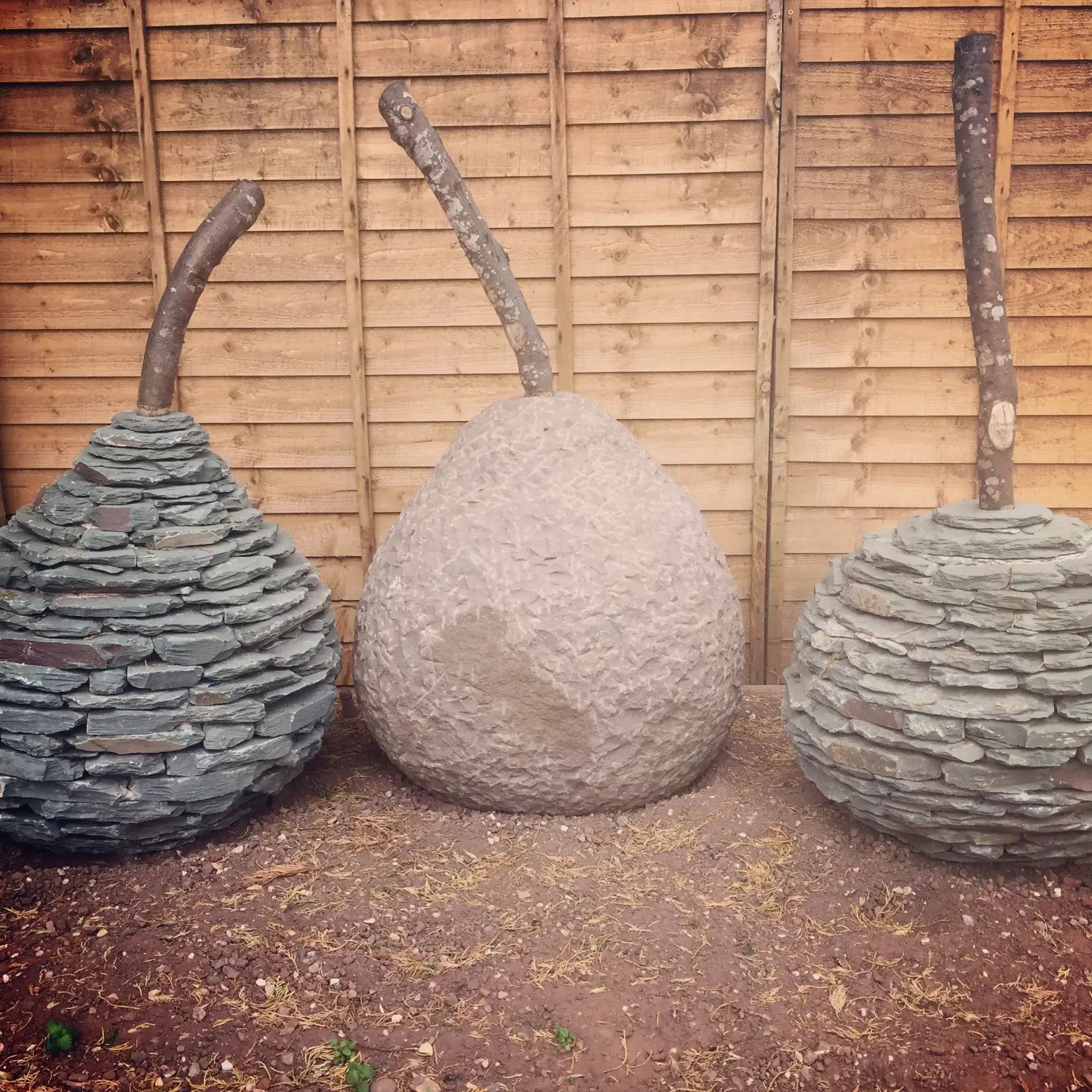 three pear sculptures