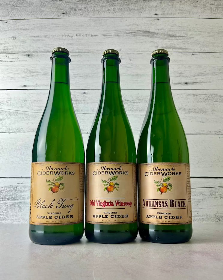 Three 750 mL bottles of Albemarle Ciderworks cider - Black Twig, Old Virginia Winesap, and Arkansas Black