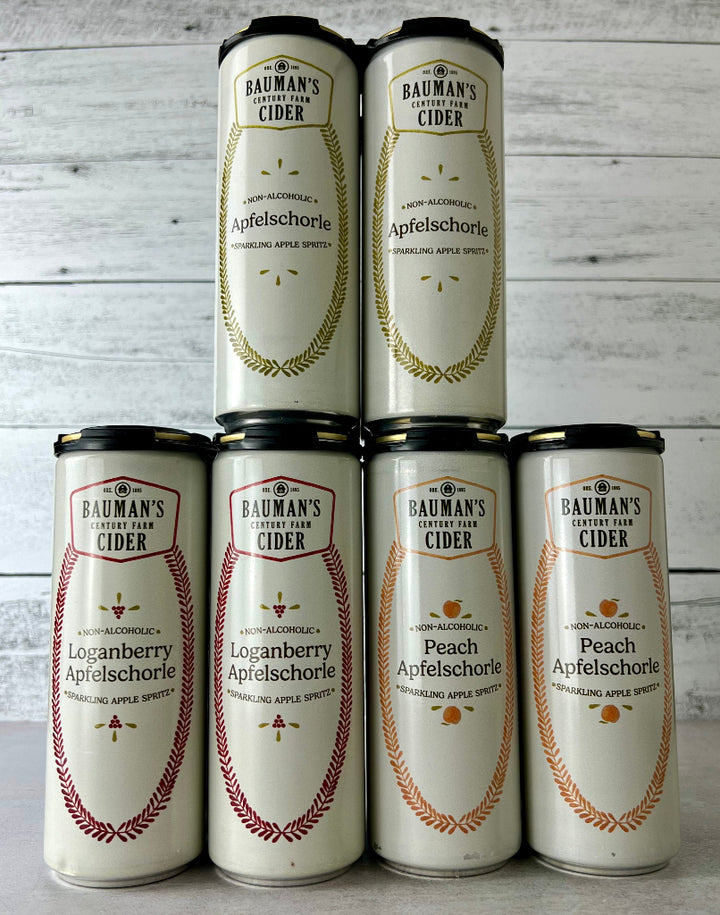 Three 4-packs of 12 oz Cans of Bauman's Non-Alcoholic Cider Apfelschorle - sparkling apple spritz, including apple, loganberry, and peach