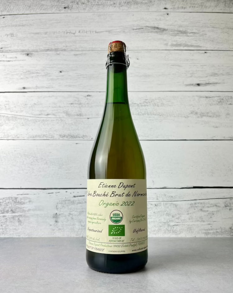 750 mL bottle of Etienne Dupont Cidre Bouché Brut de Normandy Organic cider 2022 with cork and cage top