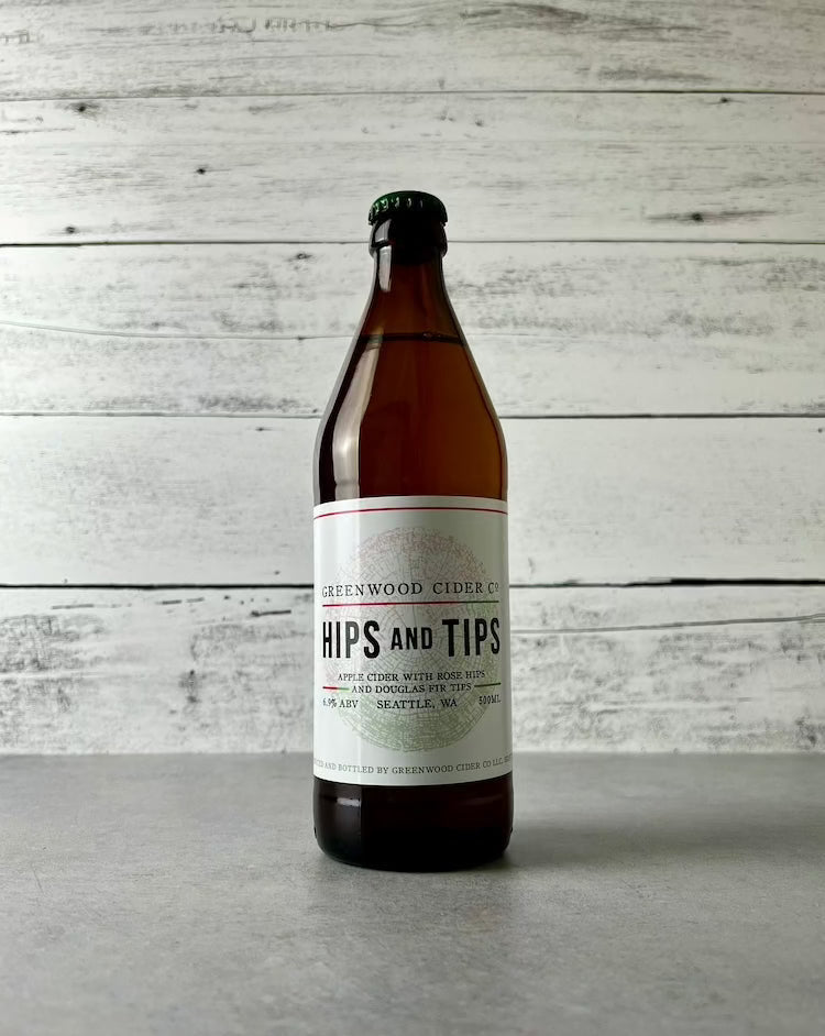 500 mL bottle of Greenwood Cider Hips and Tips - Apple Cider with Rose Hips and Douglas Fir Tips
