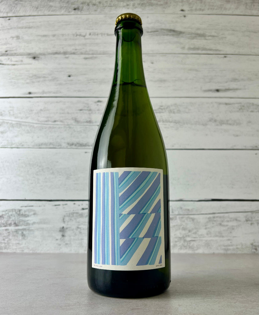 Photo of a 750 mL bottle of Western Cider Company's Harrison Rouge Semi-Dry Cider