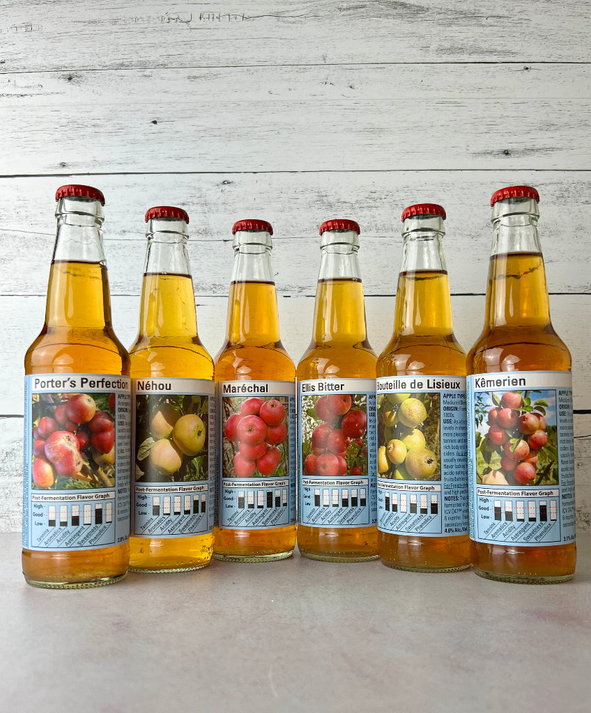 6 bottles of single varietal ciders: Porter's Perfection, Nehou, Marechal, Ellis Bitter, Bouteille de Lisieux, and Kemerien
