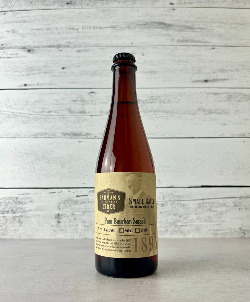 photo of a 500 mL bottle of Bauman's Pom Bourbon Smash cider