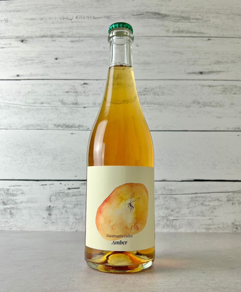 Photo of a 750 mL bottle of Bauman's Cider Amber cider