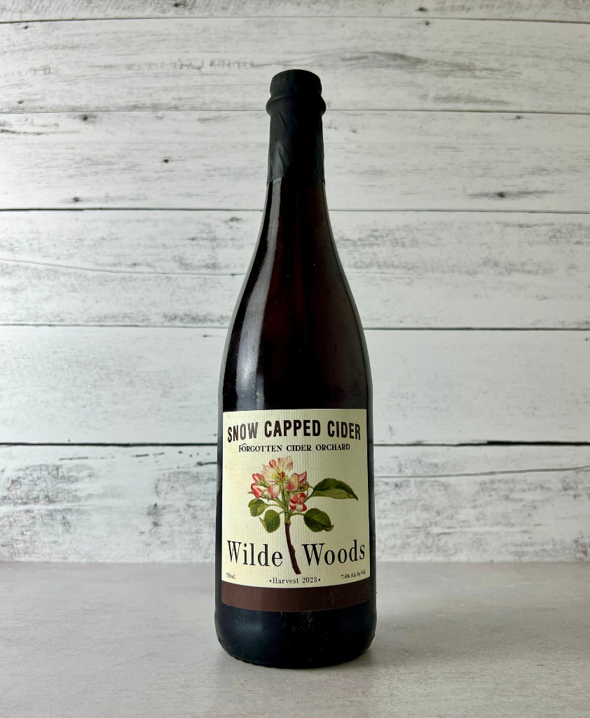 Photo of a 750 mL bottle of Snow Capped Cider Forgotten Cider Orchard Wilde Woods