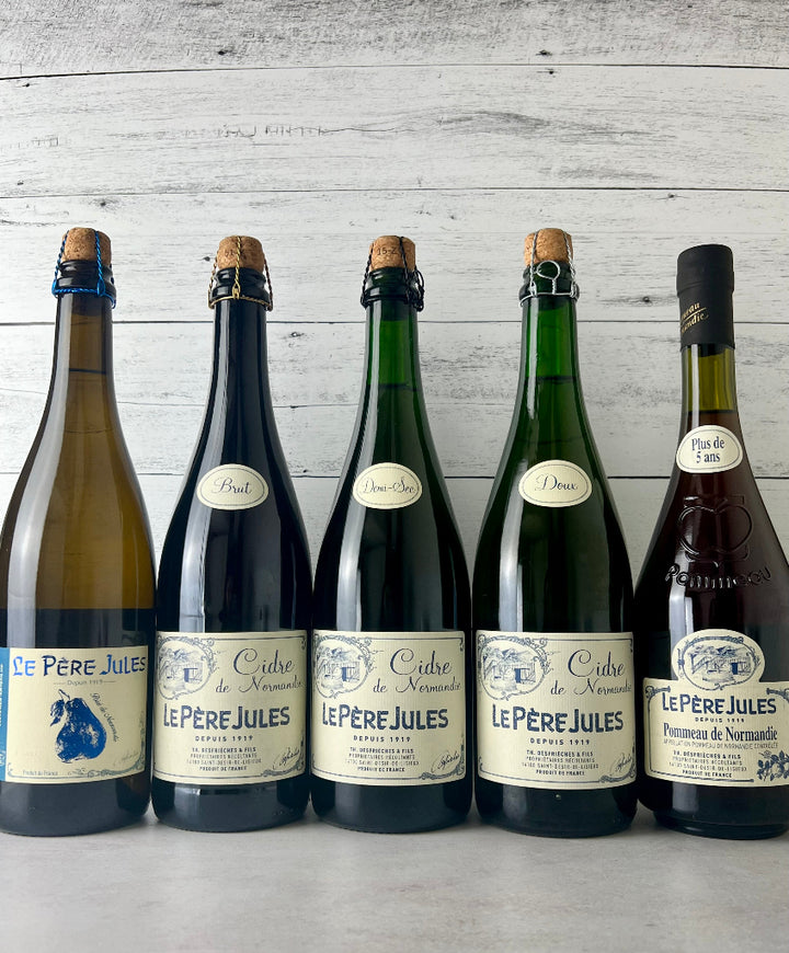Photo of 5 bottles of Le Pere Jules - Poire, Brut Cidre, Demi-Sec Cidre, Doux Cidre, and Pommeau de Normandie