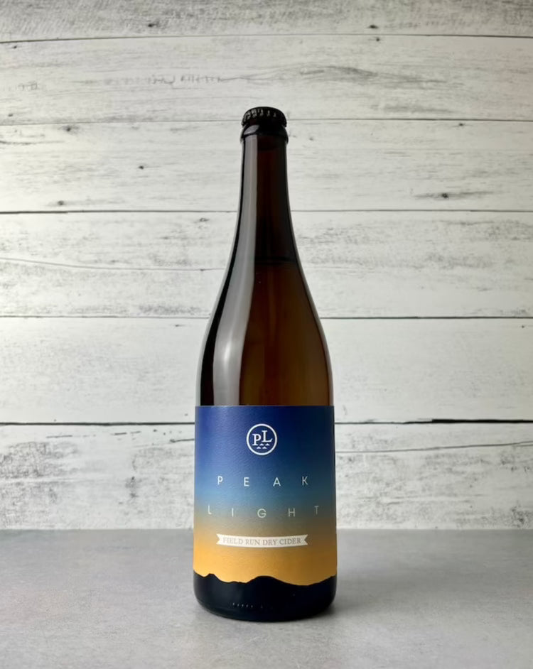 750 mL bottle of Peak Light Field Run Dry Cider