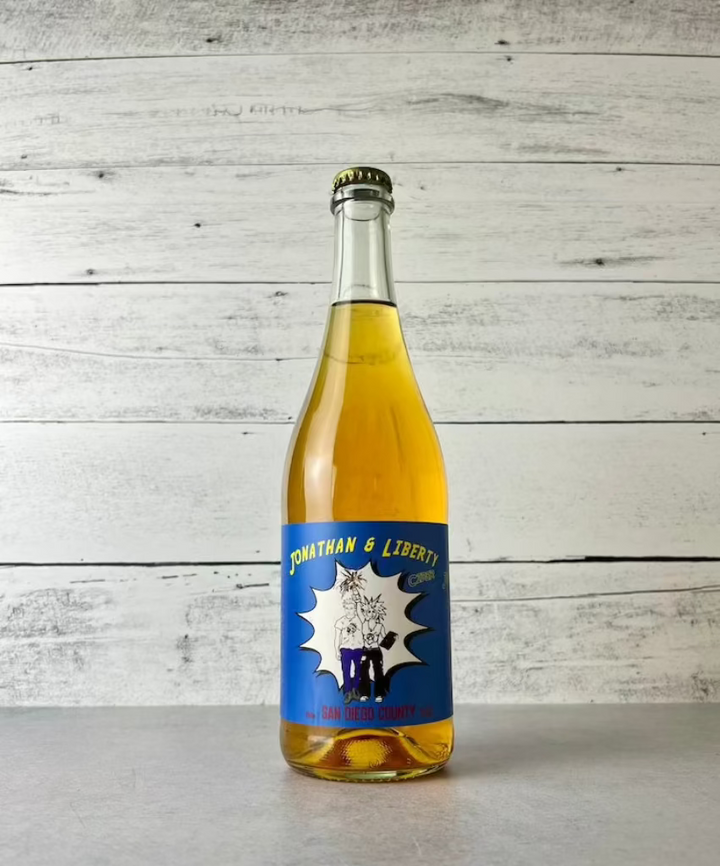 Photo of a 750 mL bottle of Raging Jonathan & Liberty cider