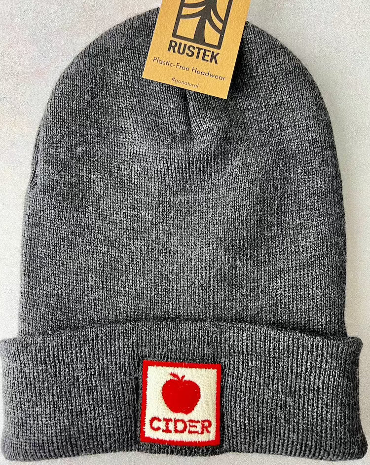 grey wool beanie with square embroidered patch with a red border, red apple, and red "CIDER" text