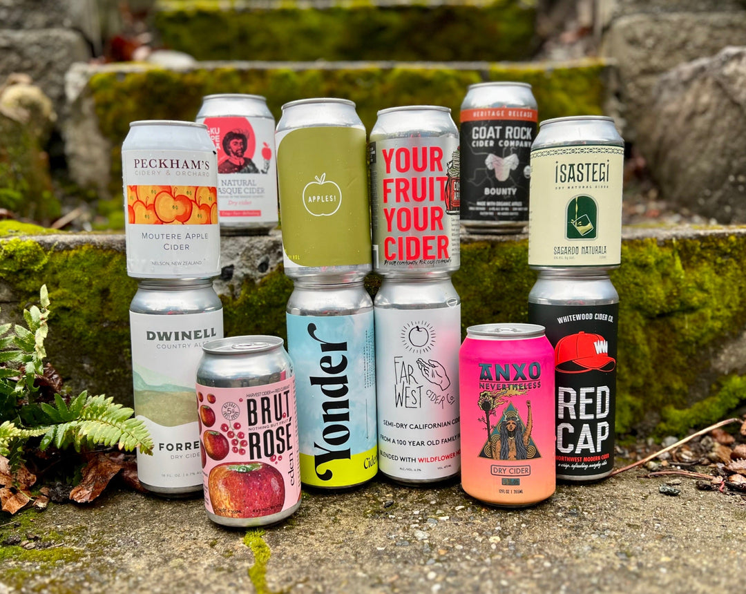 12 cans of cider, including Peckham's, Dwinell, Yonder, Anxo, Isastegi, and Whitewood Cider