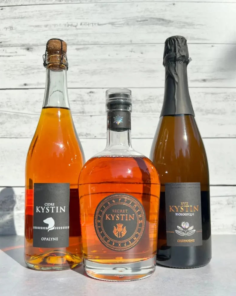 Three bottles of Kystin Cidre French cider and Secret Ice cider