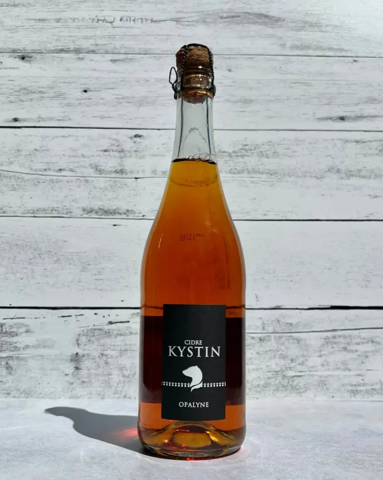 750 mL bottle of Kystin Cidre Opalyne Brut cider with cork and cage top