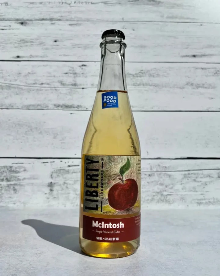 500 mL clear glass bottle of Liberty Ciderworks McIntosh Single Varietal Cider