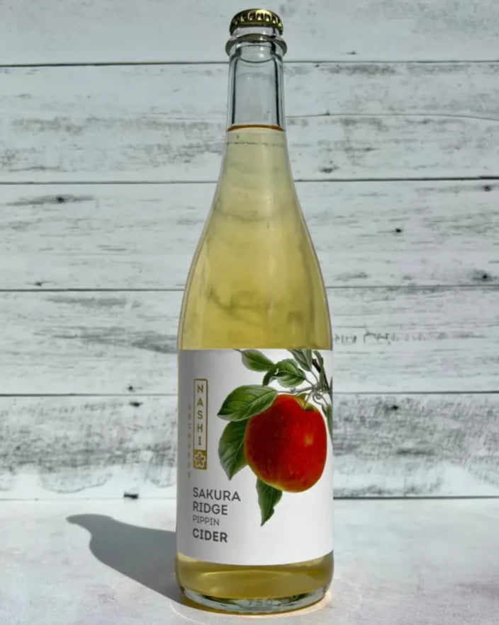 750 mL clear glass bottle of Nashi Orchards Sakura Ridge Pippin Cider