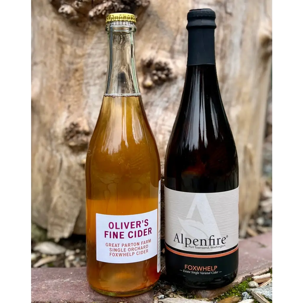 Two bottles of cider - Oliver's Fine Cider Great Parton Farm Single Orchard Foxwhelp Cider, and Alpenfire Foxwhelp Estate Single Varietal Cider