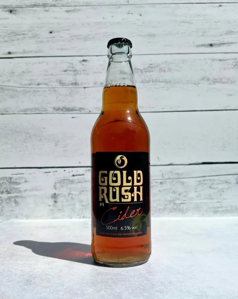 500 mL clear glass bottle of deep amber colored Oliver's Gold Rush #4 Cider