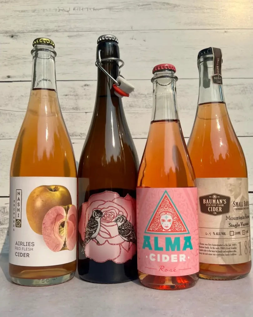 4 bottles of rosé cider from Nashi Orchards, Art + Science, Alma Cider, and Bauman's Cider