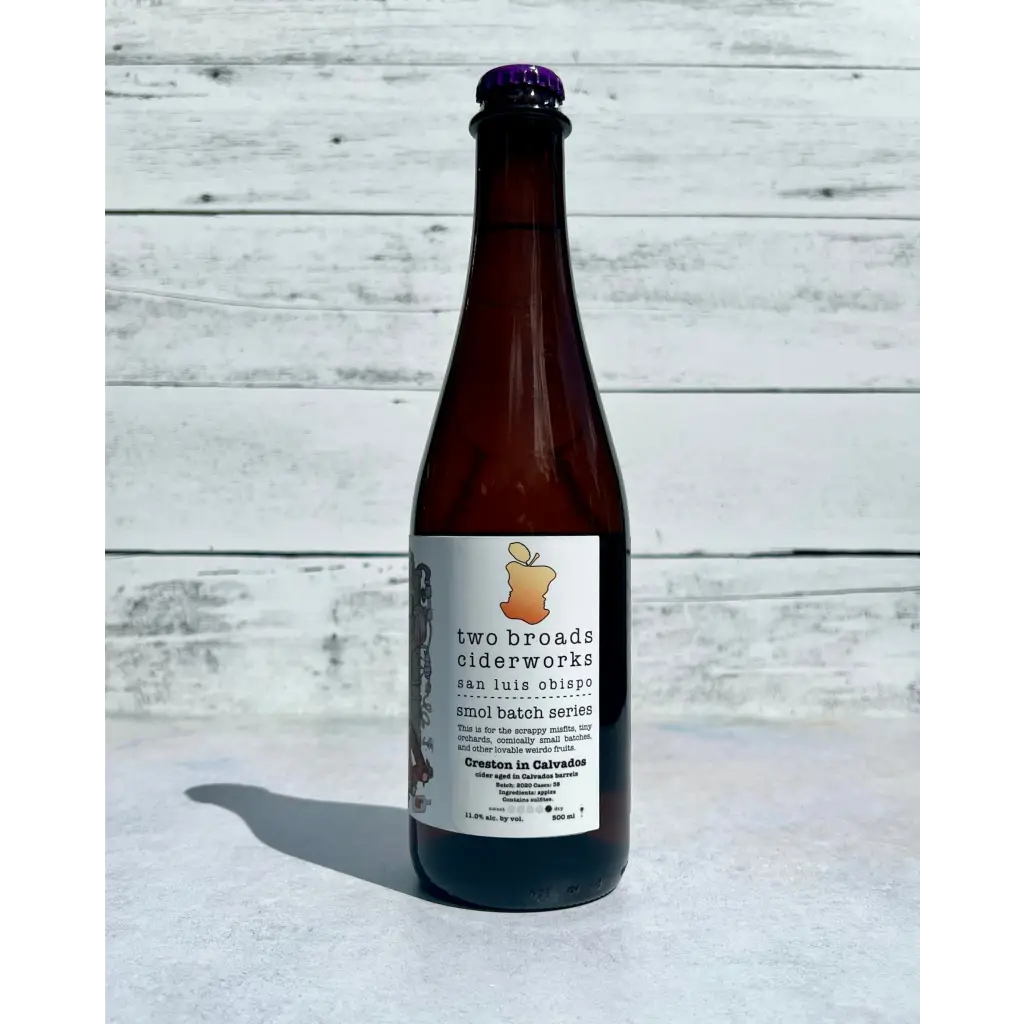 750 mL bottle showing side label of Two Broads Ciderworks - Creston in Calvados cider - smol batch series - San Luis Obispo